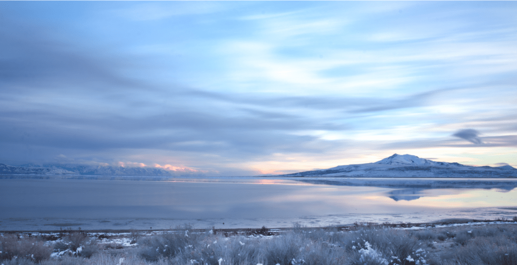 Great Salt Lake with blue-grey sky and sunset in the background