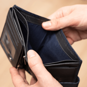 Empty leather wallet representing poverty