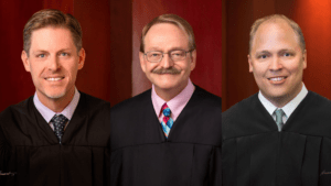 Judge Ryan M. Harris, left (a young white man with light-brown hair and blue eyes), Judge Gregory K. Orme (a middle-aged white man with light-brown hair), and Judge Ryan D. Tenney (a young white man with light-blonde hair and blue eyes)