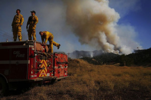 Firefighters take a break from battling the Rocky Fire in Lake County, California (Photo by Leah Mill, San Francisco Chronicle).