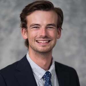 Student Bar Association president Carter Moore, a young white man with short brown hair wearing a navy blazer